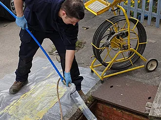 Drainage contractor repairing a drain